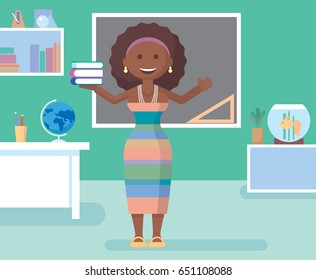 Teacher in class room. Teacher on lesson. The teacher at blackboard.