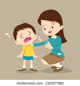 Teacher Comforting Upset Elementary School Pupil.teacher comforting crying preschool boy.