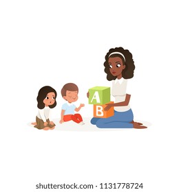 Teacher holding colored ABC cubes. Little boy and girl learning alphabet letters. Flat vector design