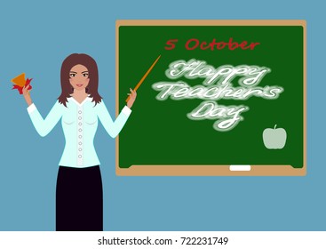 The teacher holds a bell in his hand and points to the board with a pointer. The inscription on the school board Happy Teachers' Day.