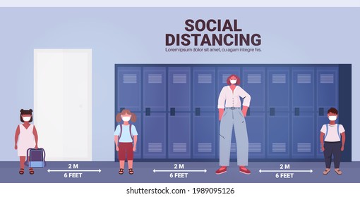 teacher and pupils in protective masks keeping distance to prevent coronavirus pandemic social distancing