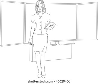 teacher standing in front of blackboard