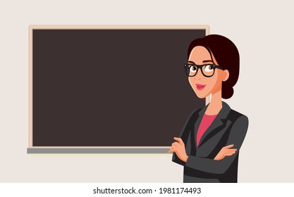 Teacher Standing in Front of a Blackboard in Class. Female professor working in academic institute 
