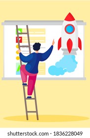 The teacher stands on a stepladder near the blackboard and points his finger at an image of a rocket and text. Explanation of a new topic. Astronomy and rocket science lesson. Space training