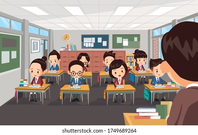 The teacher is teaching students at school