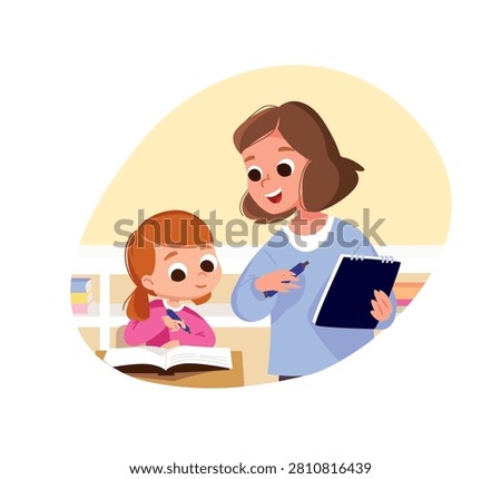 Teacher with a textbook in her hands stands near student girl, student listens attentively at teacher, listens to the lecture, lesson and writes in workbook. Teacher introducing the subject to primary school kid. 