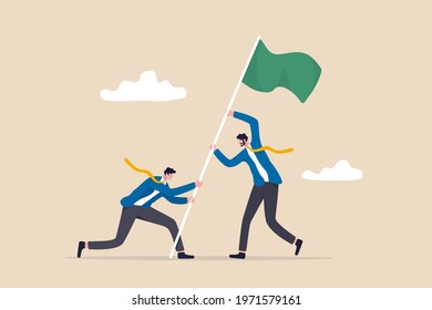 Team achievement, business challenge and victory or winner reaching goal and target concept, businessmen people teamwork or partnership helping raising winning flag.