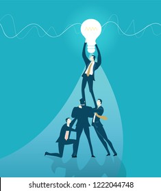 Team of business people fixing the light bulb. Idea, modification and support concept. Working together. 