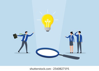 team of business professionals observing a lightbulb suspended from magnifying glass. 