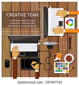 Team of designers working together on a computer. Creative team. flat design style