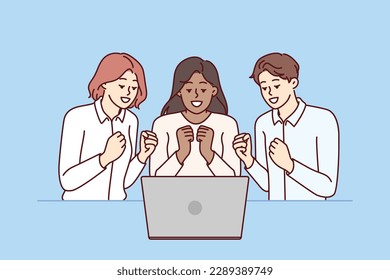 Team of excited friends sitting near laptop and watching football match together. Team of man and two girls watch video broadcast and clench fists, wanting to hear important news via video link 