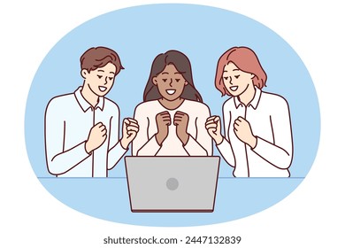 Team of excited friends sitting near laptop and watching football match together. Team of man and two girls watch video broadcast and clench fists, wanting to hear important news via video link