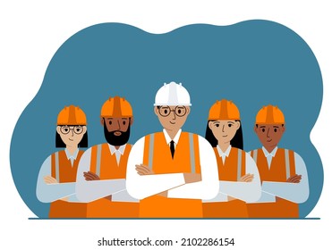 A team of smiling construction workers in white and orange hard hats and orange vests. Engineer and builders.