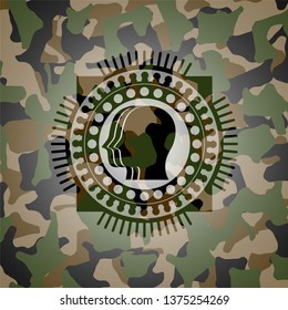 team work icon inside camouflage emblem