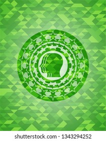 team work icon inside green emblem with triangle mosaic background