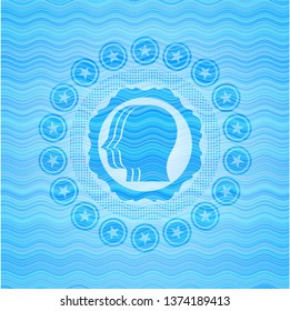team work icon inside light blue water wave badge.