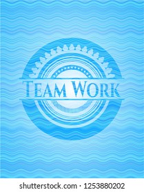 Team Work sky blue water wave badge.