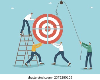 Teamwork and brainstorming to find winning strategy to achieve target, accuracy in setting and planning path to success, performance and successful completion of work tasks, people folding dart board.