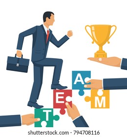 Teamwork concept. Businessman holds puzzles in hand. Business people. Vector illustration flat style design. Working together cooperation, combining. Man climbs stairs to victory. Win the cup.