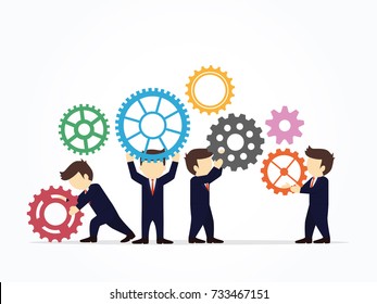 Teamwork concept. Businessmen holding gears.