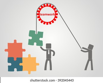 teamwork concept - an employee raises a puzzles on a rope
