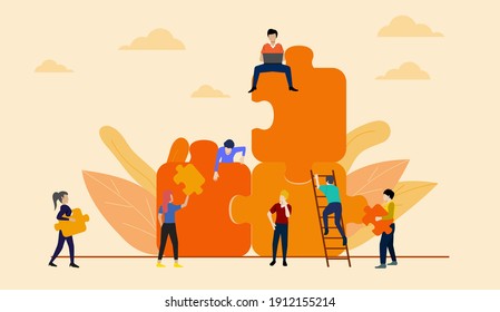 Teamwork concept. People working with giant jigsaw pieces on orange sky background