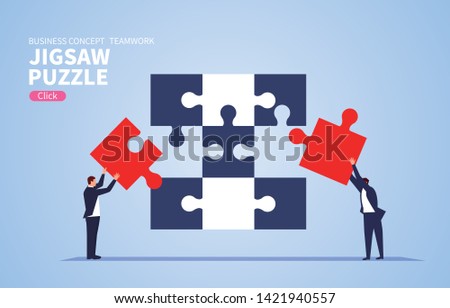 Teamwork concept, two businessmen fight jigsaw puzzle together
