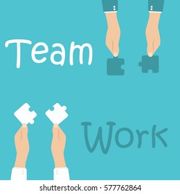Teamwork and cooperation concept. Hands holding and putting puzzle pieces together.