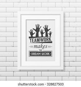 Teamwork makes the dream work - Quote typographical Background in realistic square white frame on the brick wall background. Vector EPS10 illustration. 