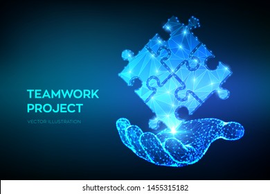 Teamwork. Puzzle elements in hand. Team metaphor. Symbol of teamwork, cooperation, partnership, association and connection. Polygonal puzzle pieces. Business concept of connecting. Vector Illustration