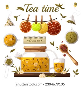 teapot with floral green tea and glass cup with tea and tea bags with tea leaves and citrus