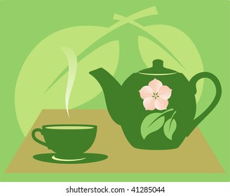 Teapot with a tea cup on a green background with a flower and leaves.