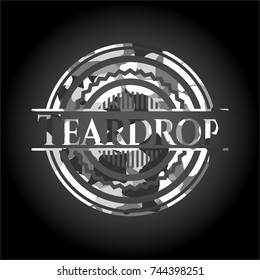 Teardrop written on a grey camouflage texture