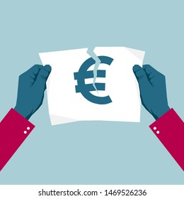 Tears the euro symbol with both hands. Isolated on blue background.