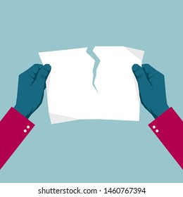 Tears the paper with both hands. Isolated on blue background.