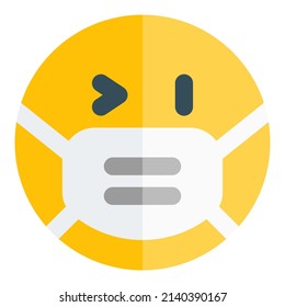 Teasing emoji with right eye wink while wearing the mask