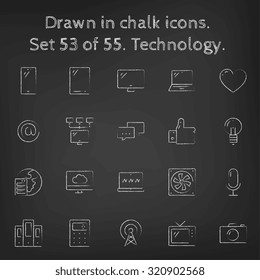 Technology icon set hand drawn in chalk on a blackboard vector white icons on a black background.