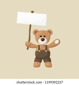 Teddy bear with black pants and white sign. 