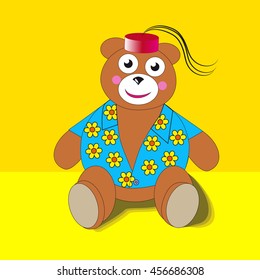 Teddy bear in a blue shirt with a red cap on a yellow background.