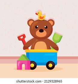 Oso de peluche con juguete de carreta