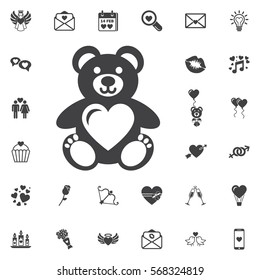 Teddy bear with heart vector icon on the white background.