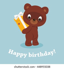 Teddy bear holding a gift box with bow. Festive vector cartoon illustration. Happy birthday card with greeting text