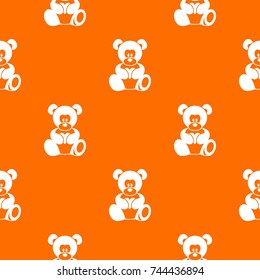 Teddy bear holding a heart pattern repeat seamless in orange color for any design. Vector geometric illustration