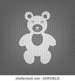 Teddy bear sign illustration. Vector. White knitted icon on gray knitted background. Isolated.