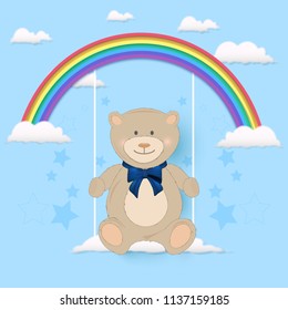 Teddy bear sitting on swing of rainbow Greeting card on blue sky background