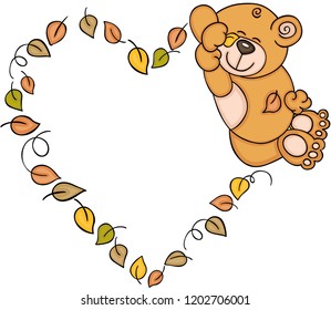 Teddy bear sleeping with fall leaves shaped heart frame