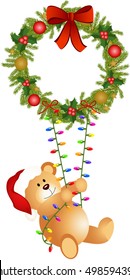 Teddy bear swinging on Christmas wreath
