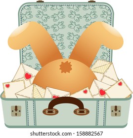 Teddy bear upside down in the love letter suitcase