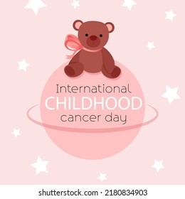 El oso marrón de Teddy se sienta en el planeta en honor del Día Mundial del Cáncer