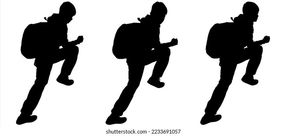 The teen climbs the slope. The traveler goes to the mountains with a backpack. A boy with a backpack behind his back, raised one leg high, makes a rise. Side view. Black silhouette isolated on white